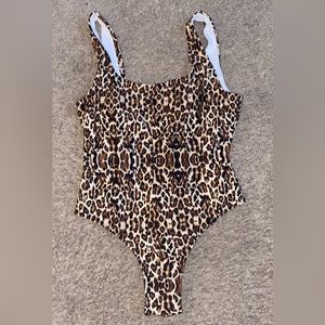 Size XL Leopard print one piece from Amazon. Never been worn!